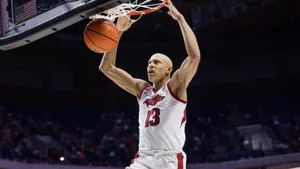 Basketball Player Dunking Action Wallpaper