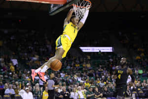 Basketball Player Dunking During Game.jpg Wallpaper