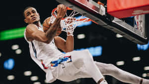 Basketball Player Dunking During Game.jpg Wallpaper