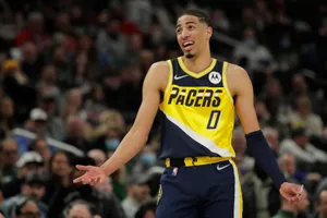 Basketball Player Expressive Gesture During Game Wallpaper