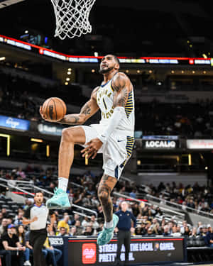 Basketball Player In Action Dunk Attempt.jpg Wallpaper