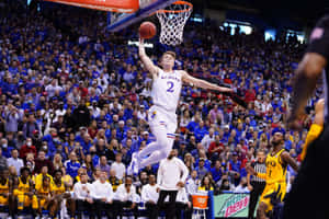 Basketball_ Player_ In_ Action_ Kansas_ Uniform Wallpaper