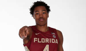 Basketball Player Pointing Florida State Uniform Wallpaper