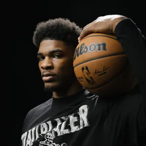 Basketball Player Portraitwith Ball Wallpaper