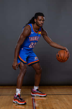 Basketball_ Player_ Posing_ With_ Ball Wallpaper