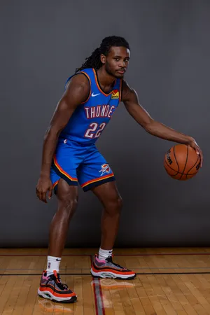 Basketball_ Player_ Posing_ With_ Ball Wallpaper