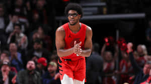 Basketball Player Red Uniform Action Shot Wallpaper
