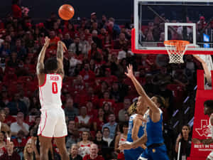 Basketball Player Shootingat Game Wallpaper