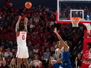 Basketball Player Shootingat Game Wallpaper