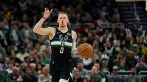 Basketball Player Signaling Play During Game.jpg Wallpaper