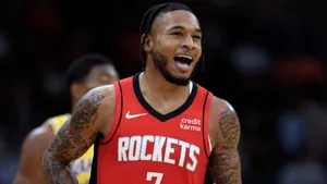 Basketball Player Smiling During Game Wallpaper