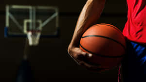 Basketball Player Taking A Three-point Shot Wallpaper