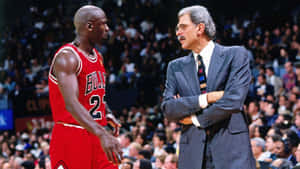 Basketball Playerand Coach Discussion Wallpaper