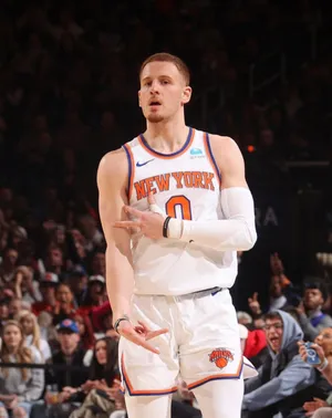 Basketball Playerin Action New York Uniform Wallpaper