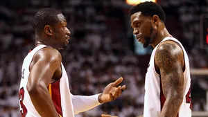 Basketball Players Strategic Discussion Wallpaper