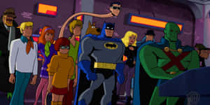 Batman And Blue Beetle In Action Wallpaper