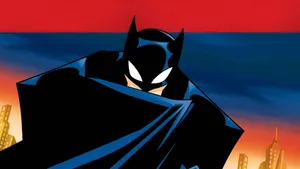 Batman And Dracula Face Off In A Dark And Atmospheric Battle Wallpaper