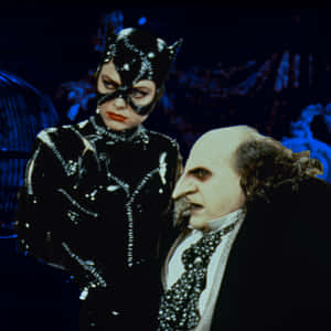 Batman And Penguin Face-off In Gotham City Wallpaper