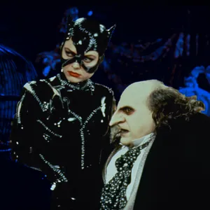 Batman And Penguin Face-off In Gotham City Wallpaper