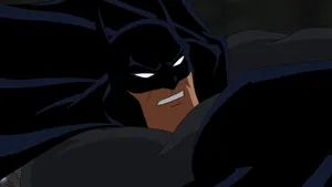 Batman And Red Hood Face-off In A Clamorous Clash Wallpaper