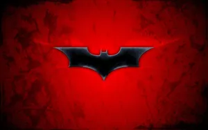 Batman And Red Hood Face-off In A Dramatic Battle Wallpaper