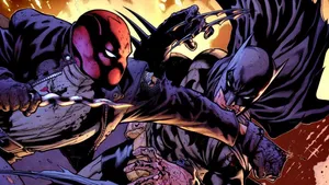 Batman And Red Hood Face Off In Intense Battle Wallpaper