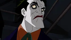 Batman And Red Hood Face Off In Intense Moment Wallpaper