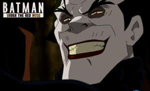 Batman And Red Hood Face-off In Intense Showdown Wallpaper