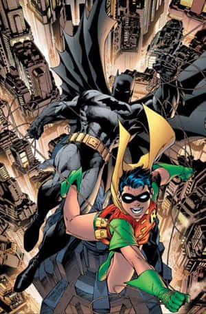 Batman And Robin Face Off In An Epic Battle Wallpaper