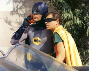 Batman And Robin With Gotham City In The Background Wallpaper