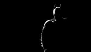 Batman Black And White - A Bold Dark Knight Stance Wallpaper