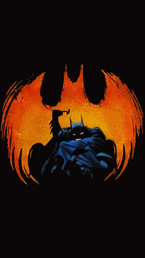 Batman Standing Against The Backdrop Of A Haunting Full Moon In The Long Halloween Wallpaper