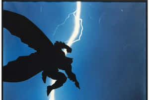 Batman, The Dark Knight, Standing Strong In Gotham City With His Bat Signal Shining In The Sky Wallpaper