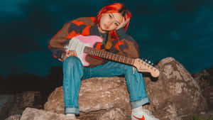 Beabadoobee Playing Guitar Outdoors Wallpaper