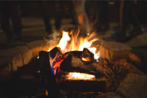 Beach Campfire Under A Starlit Sky Wallpaper