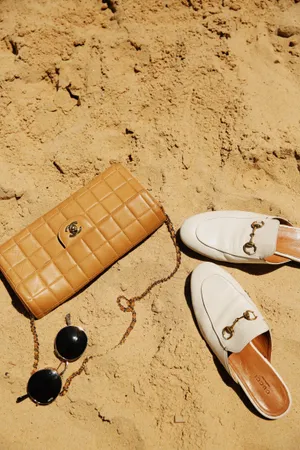 Beach Fun! Time To Hit The Shores With Stylish Sunglasses, Hats, And Colorful Beach Bag Wallpaper