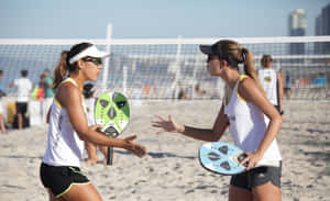 Beach Tennis: A Fun And Exciting Sport Played On The Sand Wallpaper