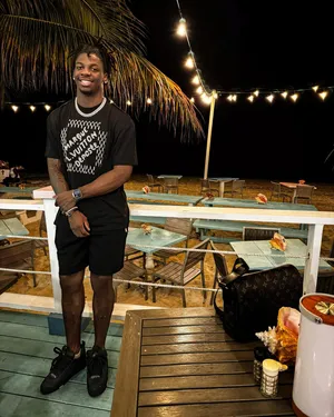 Beachside Smile Nighttime Setting Wallpaper