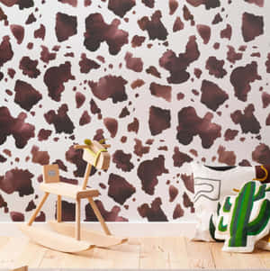 Beautiful Brown Cow Grazing In A Lush Field Wallpaper