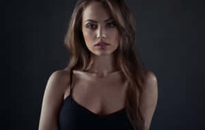 Beautiful Brown-eyed Girl Gazing Intently Wallpaper