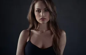 Beautiful Brown-eyed Girl Gazing Intently Wallpaper