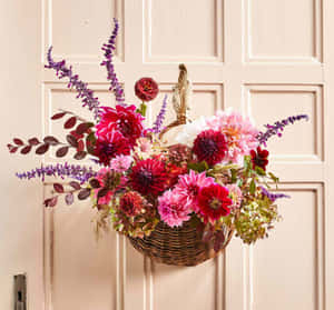 Beautiful Fall Wreath Displayed On A Rustic Door Wallpaper