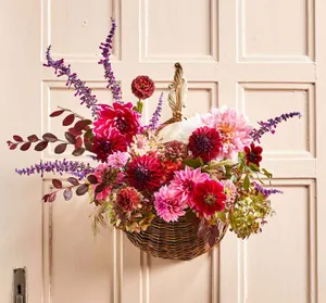 Beautiful Fall Wreath Displayed On A Rustic Door Wallpaper