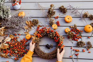 Beautiful Fall Wreath On A Rustic Wooden Door Wallpaper