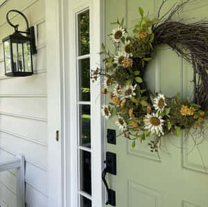 Beautiful Fall Wreath On A Wooden Door Wallpaper