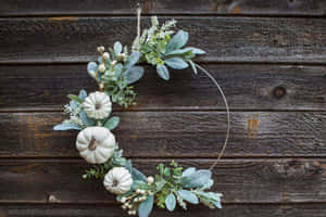 Beautiful Fall Wreath On Wooden Door Wallpaper