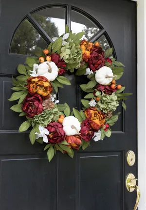 Beautiful Fall Wreath With Colorful Autumn Leaves And Berries On A Rustic Wooden Background Wallpaper