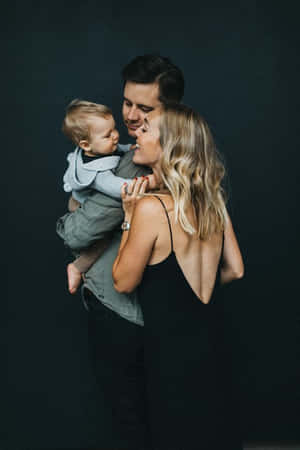 Beautiful Family Portrait Of Three Wallpaper