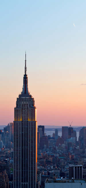 Beautiful Mid-day Skyline Of New York, Photographed From The Brooklyn Bridge. Wallpaper