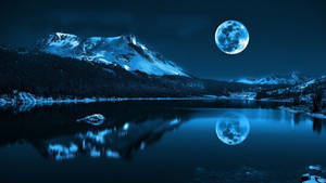 Beautiful Moon And A Snow Mountain Wallpaper